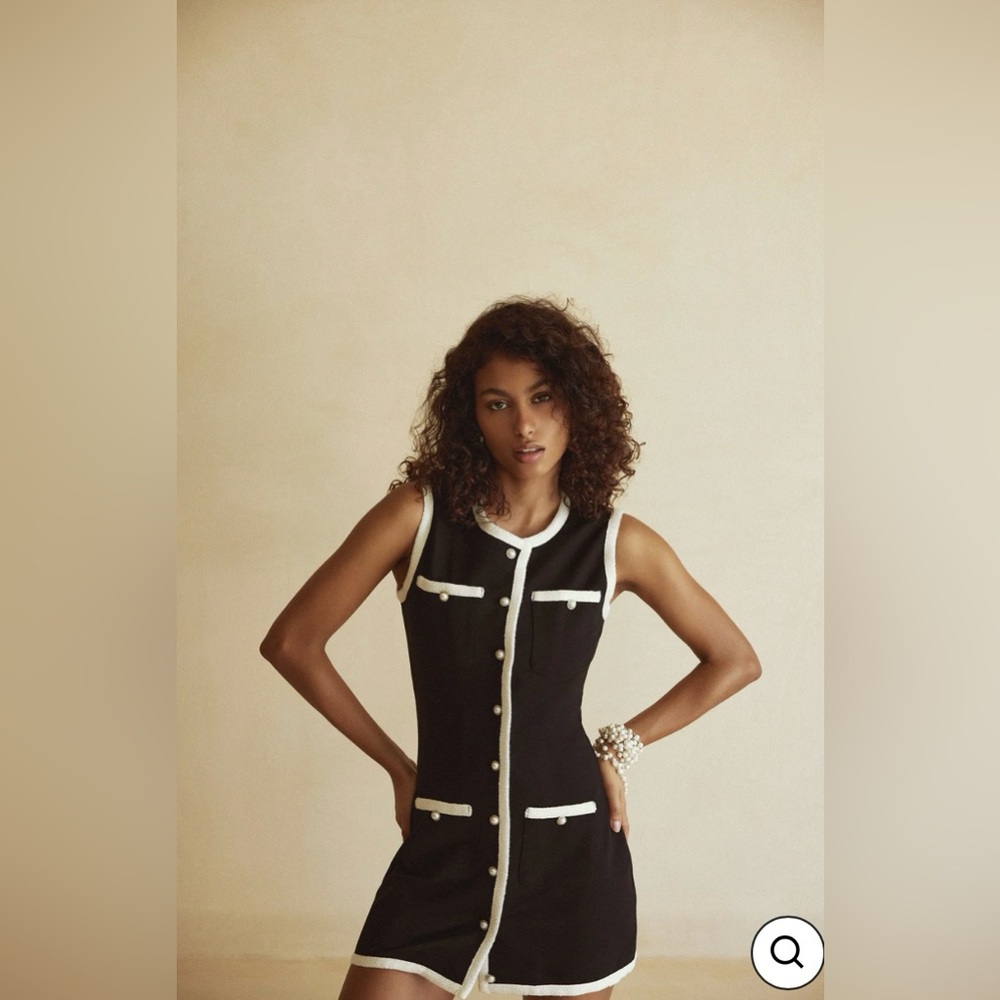 Grace Dress is a fitted, a-line mini dress with high neckline, front buttons .